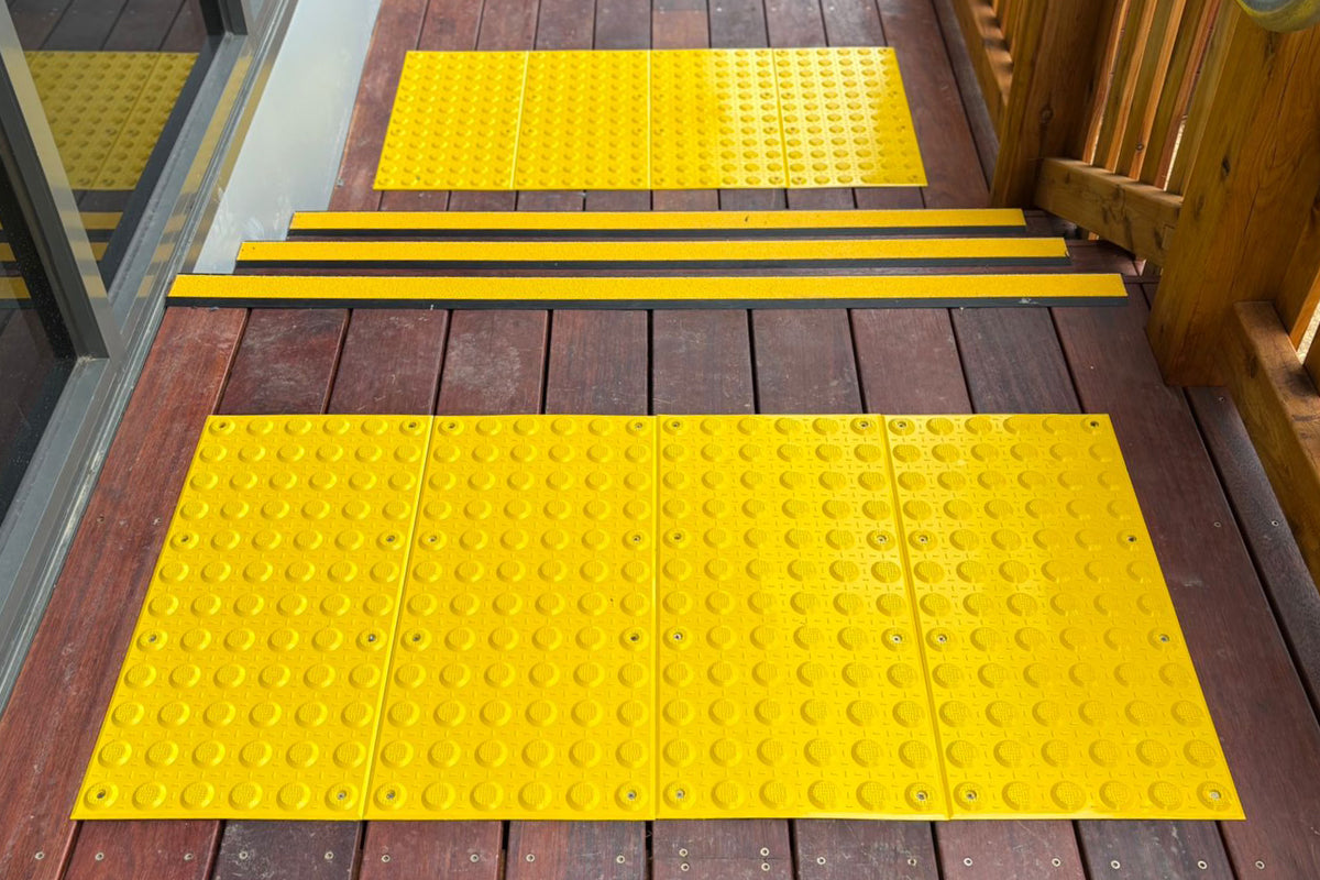 Safety and accessibility installation at childcare centre in Viewbank VIC including tactile indicators, stair nosing, wheel stops and line marking.