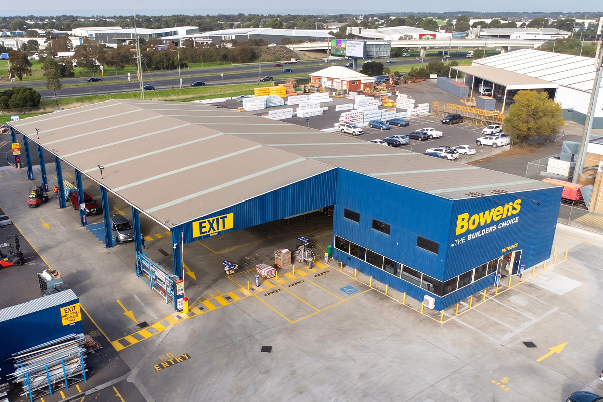 Yellow in-ground and surface-mounted bollards at the Bowens timber and hardware store in Laverton North